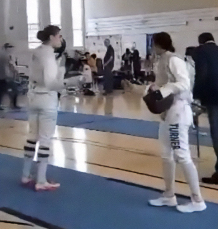 Breaking the Rules: Trans Woman Competes Topless in Men’s Race to Protest Controversial Policy - 2025 10 stephanie turner takes a knee to fencing opponent 3 67efc1acbe36e 700 685298934393e 700